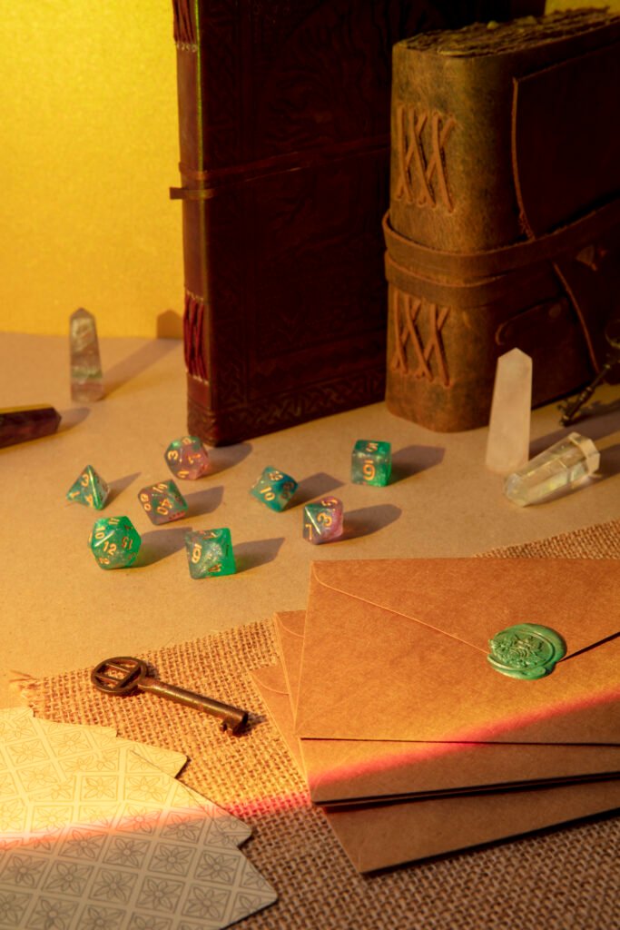 Role-playing game dice, books and accessories on a table